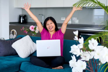 Emily Lee from speaking voices throws up her arms triumphantly to celebrate the sucess of her clients.